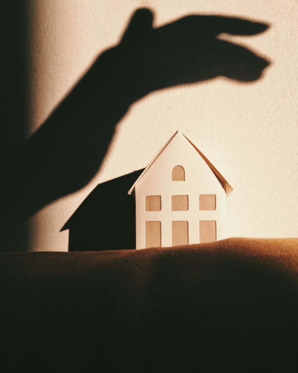 white and brown house on brown textile